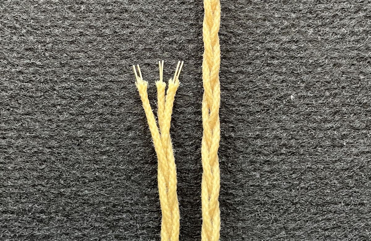 The Broberg build, an inner conductor split into three braided strands next to the finished cable